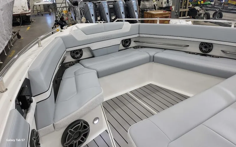 Slide: The Image of 2024 Formula 430 Super Sport Crossover boat interior with gray seating and speakers. - 29