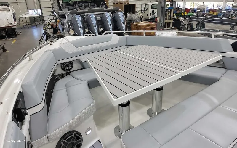 Slide: The Image of 2024 Formula 430 Super Sport Crossover boat interior with sleek seating and table. - 30