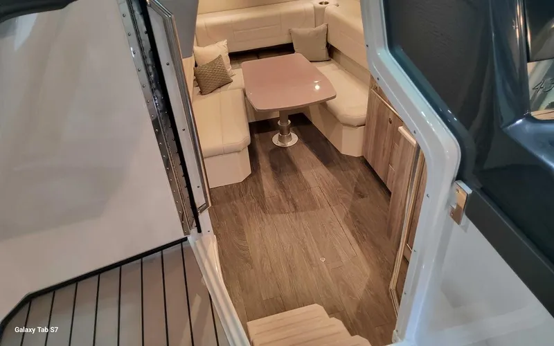 Slide: The Image of Interior of 2024 Formula 430 Super Sport Crossover with elegant seating and wooden flooring. - 33