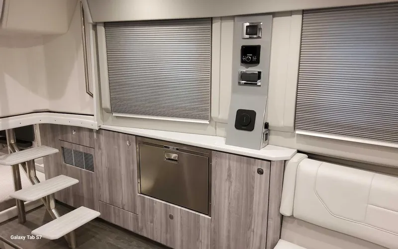 Slide: The Image of 2024 Formula 430 Super Sport Crossover interior with modern cabinetry and seating. - 36