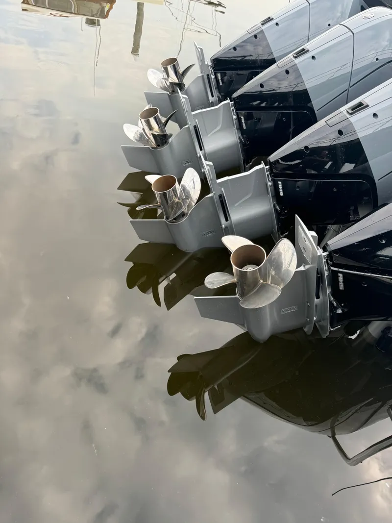 Slide: The Image of 2024 Formula 430 Super Sport Crossover boat engines and propellers in water. - 4