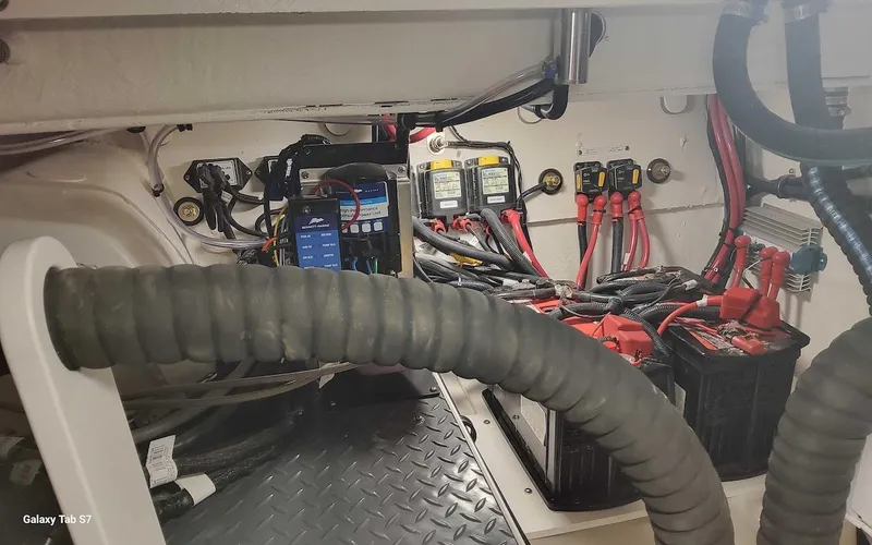 Slide: The Image of Engine compartment of 2024 Formula 430 Super Sport Crossover with batteries and wiring. - 47