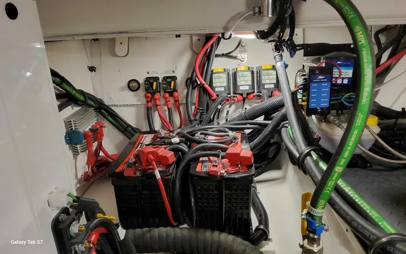 Slide: The Image of Engine room of 2024 Formula 430 Super Sport Crossover with batteries and wiring. - 49