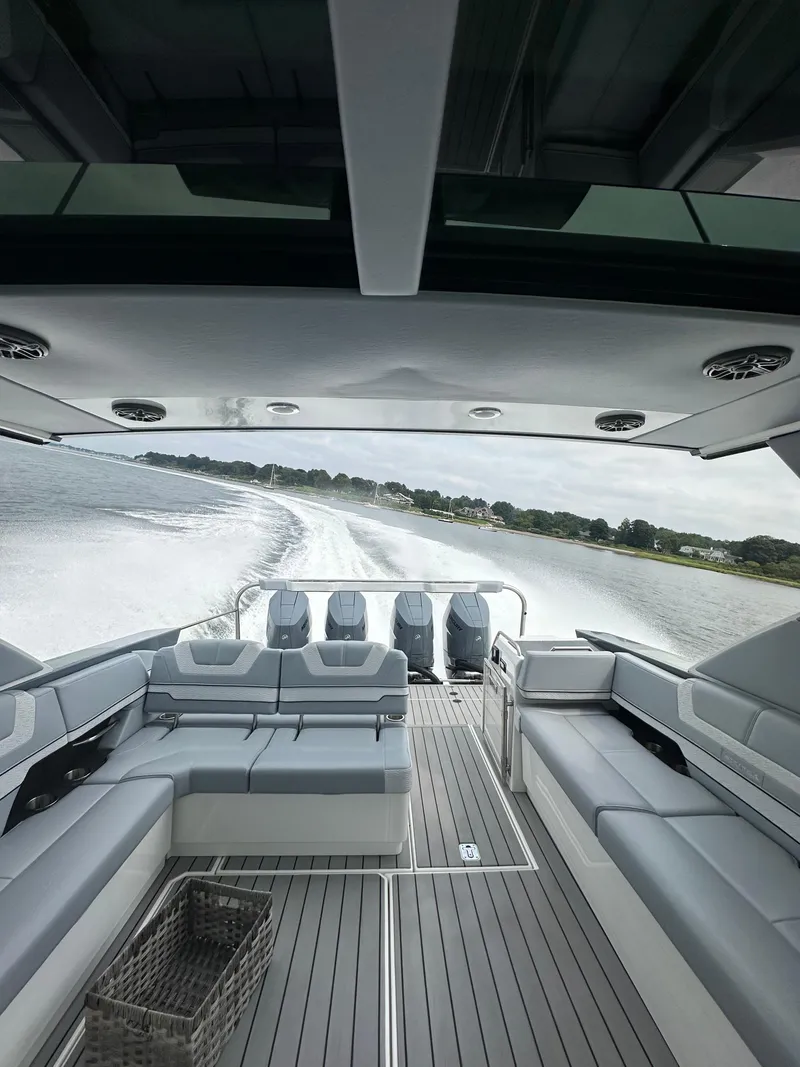 Slide: The Image of 2024 Formula 430 Super Sport Crossover cruising on open water, luxurious seating, sleek design. - 5