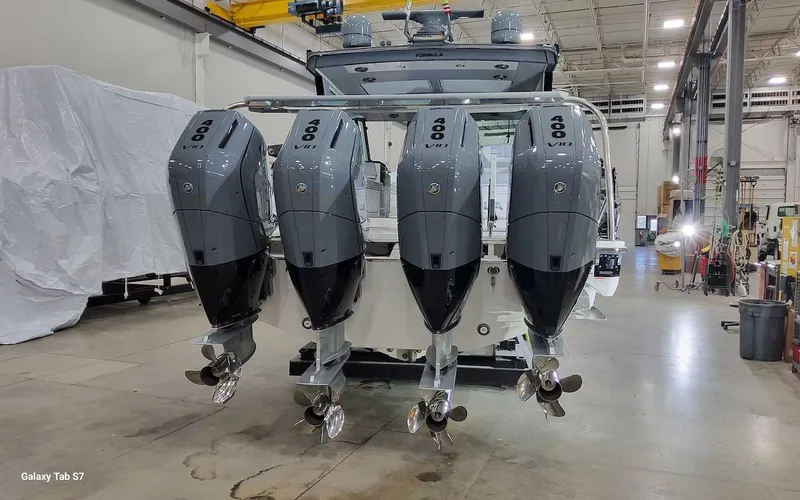 Slide: The Image of 2024 Formula 430 Super Sport Crossover with quad outboard engines in a warehouse setting. - 7