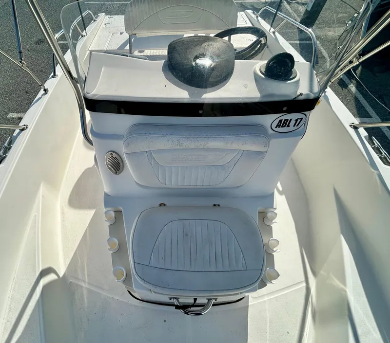 Slide: The Image of 2011 Boston Whaler DAUNTLESS 180/CC boat interior with steering console and seating. - 10