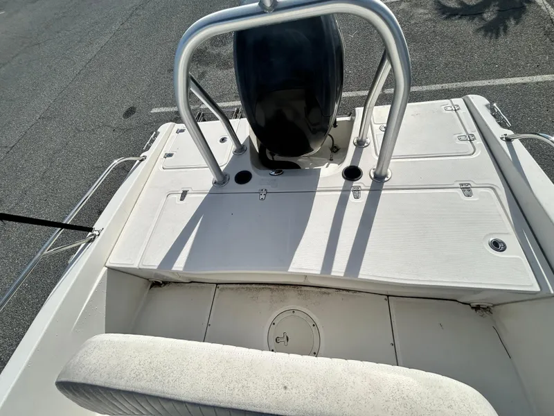 Slide: The Image of 2011 Boston Whaler DAUNTLESS 180/CC boat deck with motor and seating. - 12