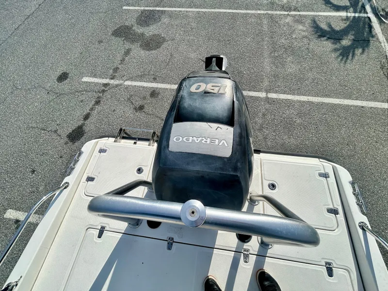 Slide: The Image of 2011 Boston Whaler Dauntless 180/CC with 150 Verado engine, parked on asphalt. - 14