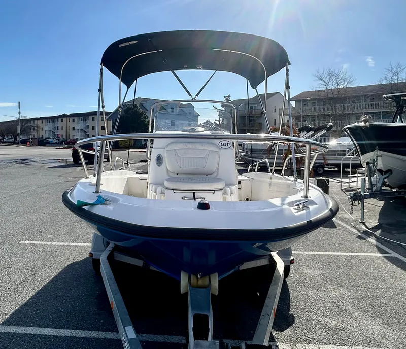 Slide: The Image of 2011 Boston Whaler DAUNTLESS 180/CC boat on trailer, sunny day. - 5