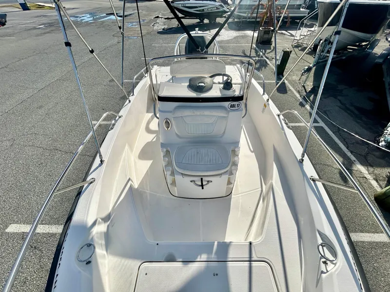 Slide: The Image of 2011 Boston Whaler DAUNTLESS 180/CC boat, center console view, docked in a marina. - 7