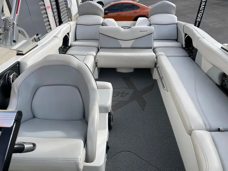 Slide: The Image of 2016 MasterCraft X46 boat interior with luxurious white seating and modern design. - 13