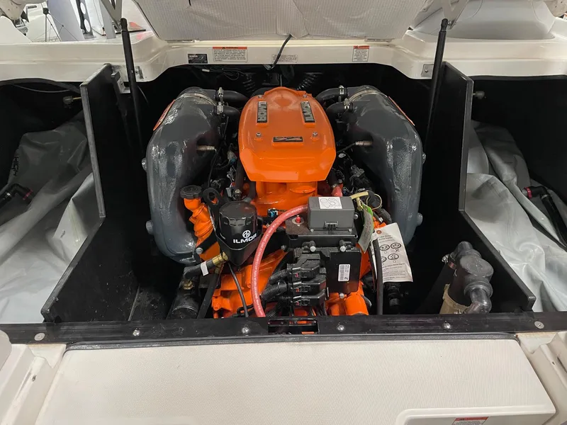 Slide: The Image of 2016 MasterCraft X46 engine compartment with vibrant orange engine components. - 15