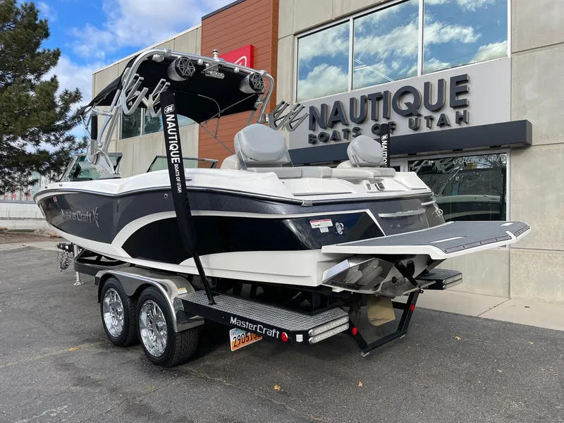 Slide: The Image of 2016 MasterCraft X46 boat on trailer outside Nautique dealership. - 3