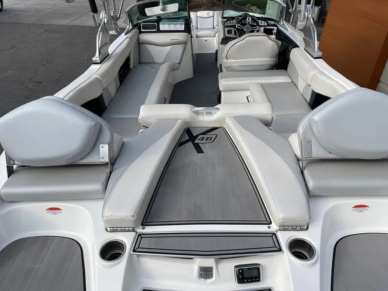 Slide: The Image of 2016 MasterCraft X46 boat interior with sleek seating and modern design. - 5