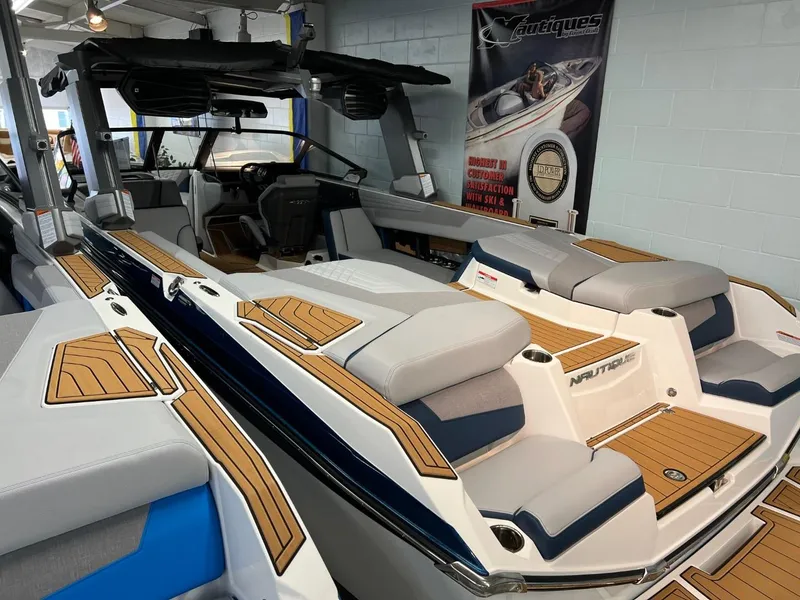 Slide: The Image of 2023 Nautique Super Air Nautique G25 boat with luxurious seating and sleek design. - 3