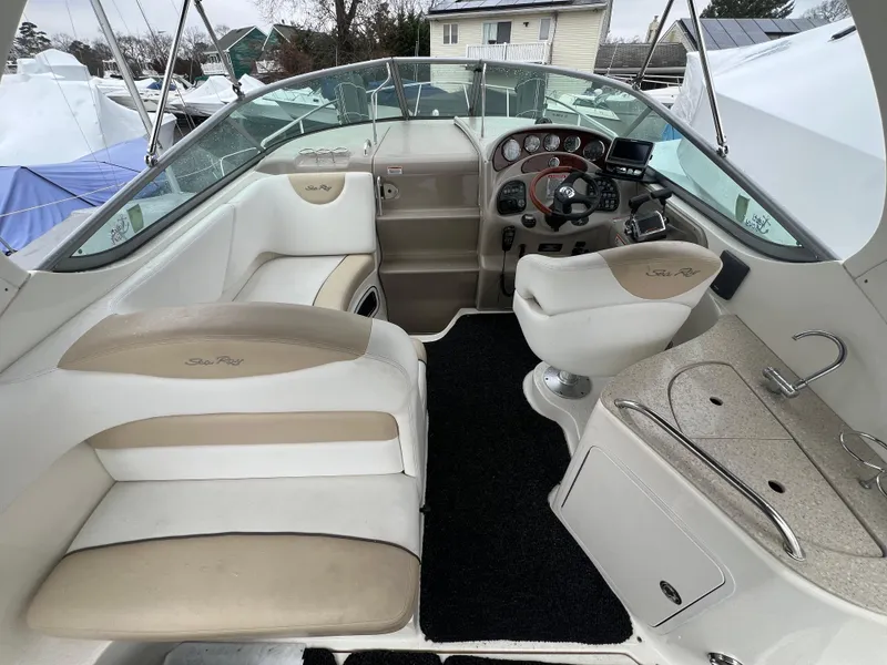 Slide: The Image of 2008 Sea Ray 280 Sundancer boat interior with helm, seating, and dashboard. - 12