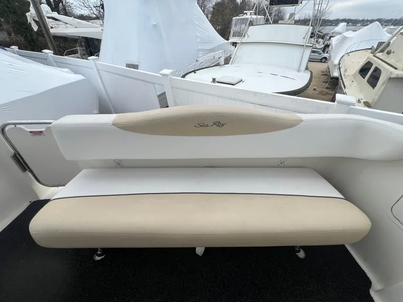 Slide: The Image of 2008 Sea Ray 280 Sundancer boat seating area with beige and white upholstery. - 17