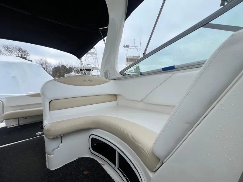Slide: The Image of 2008 Sea Ray 280 Sundancer interior seating with beige and white upholstery. - 29