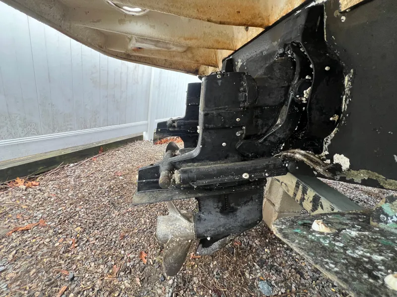 Slide: The Image of 2008 Sea Ray 280 Sundancer boat stern drive on gravel surface. - 33