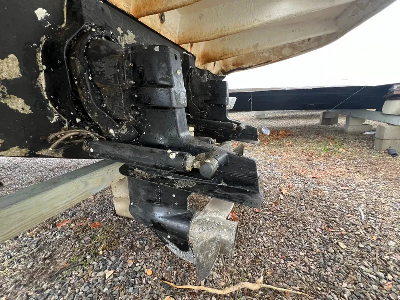 Slide: The Image of Close-up of 2008 Sea Ray 280 Sundancer boat propeller and stern drive on gravel. - 34