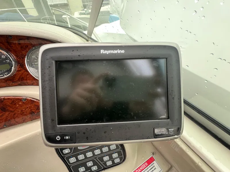 Slide: The Image of Raymarine navigation system on 2008 Sea Ray 280 Sundancer boat dashboard. - 5