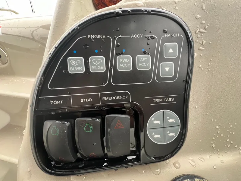 Slide: The Image of Control panel of a 2008 Sea Ray 280 Sundancer boat with various switches and buttons. - 8