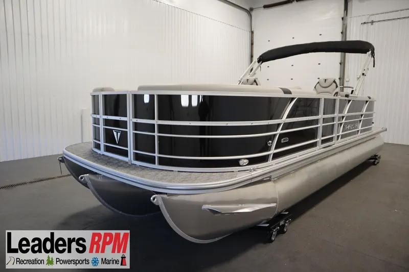 The Image of 2025 Trifecta 24RF LE 2.75 pontoon boat in showroom, featuring sleek design and modern amenities. - 1