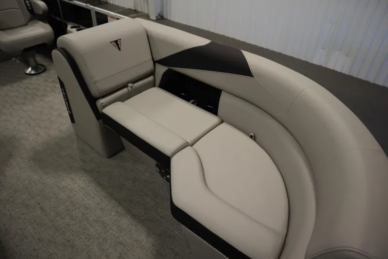 Slide: The Image of 2025 Trifecta 24RF LE 2.75 storage compartment with cup holders and sleek design. - 10