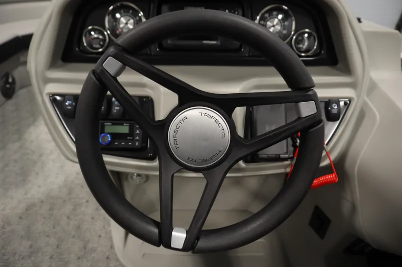 Slide: The Image of Luxurious seating in 2025 Trifecta 24RF LE 2.75 pontoon boat, featuring elegant beige upholstery. - 15