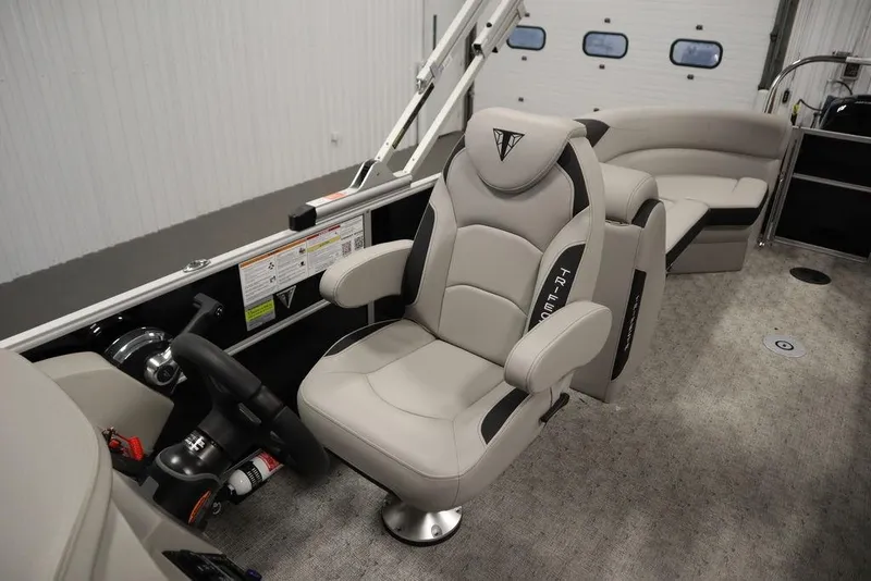 Slide: The Image of Luxurious interior of 2025 Trifecta 24RF LE 2.75 pontoon boat with plush seating. - 30
