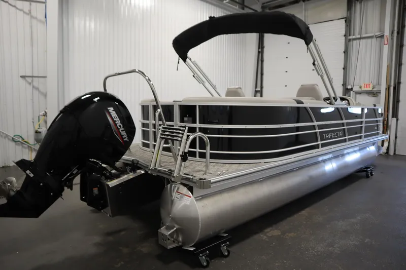 Slide: The Image of 2025 Trifecta 24RF LE 2.75 pontoon boat in a showroom setting. - 4