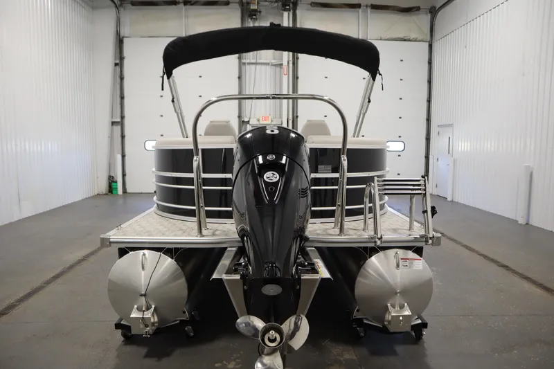 Slide: The Image of 2025 Trifecta 24RF LE 2.75 pontoon boat in a showroom setting. - 5