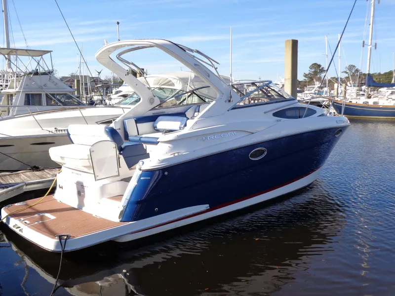 Slide: The Image of 2014 Regal 3060 Window Express boat docked in marina. - 1