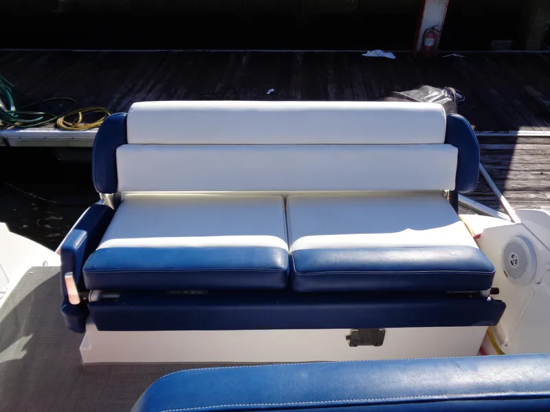 Slide: The Image of 2014 Regal 3060 Window Express boat seating, blue and white upholstery. - 20