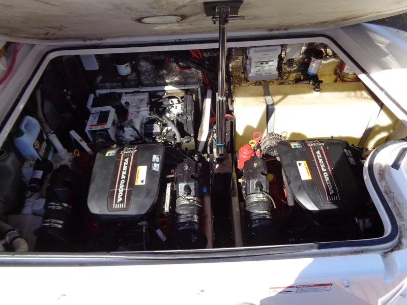 Slide: The Image of Engine compartment of a 2014 Regal 3060 Window Express boat, featuring dual Volvo Penta engines. - 36