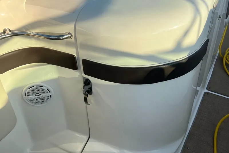 Slide: The Image of 2013 Sea Ray 300 SLX boat interior with speaker and railing detail. - 14