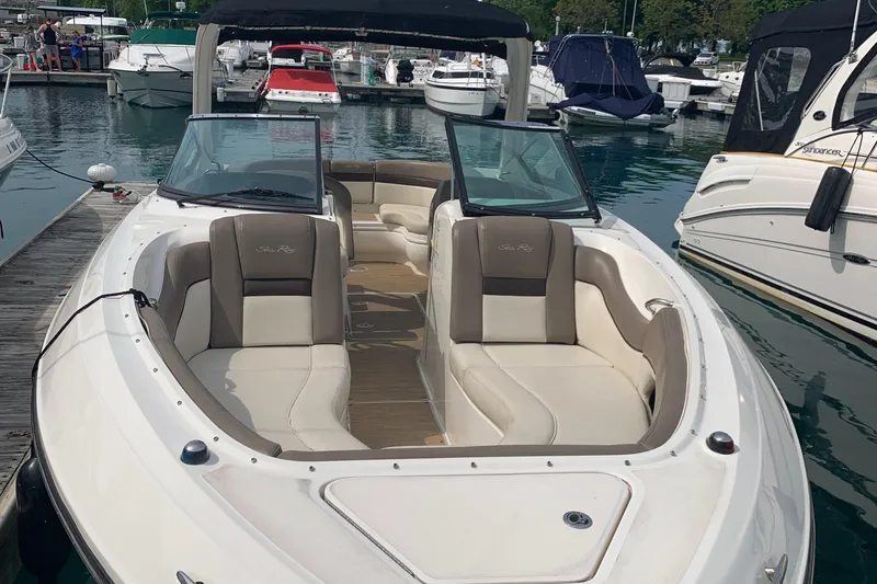 Slide: The Image of 2013 Sea Ray 300 SLX boat docked at marina with spacious seating. - 3