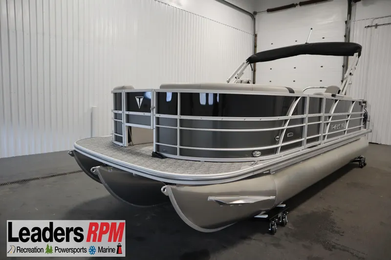 The Image of 2025 Trifecta 22TRFC LE 2.75 pontoon boat in showroom, Leaders RPM logo visible. - 1