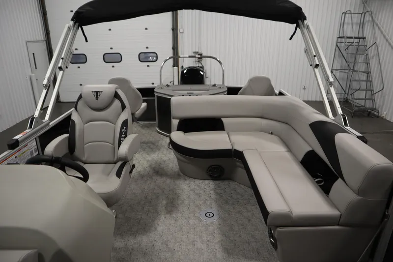 Slide: The Image of 2025 Trifecta 22TRFC LE 2.75 boat interior with steering wheel and seating. - 19