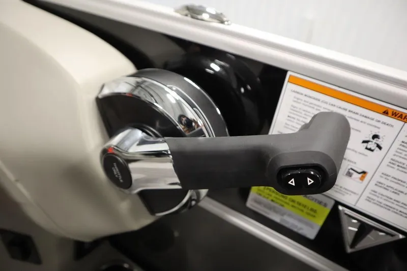 Slide: The Image of Throttle control of 2025 Trifecta 22TRFC LE 2.75 boat with warning labels. - 29