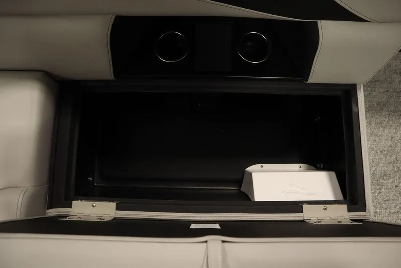 Slide: The Image of Storage compartment in 2025 Trifecta 22TRFC LE 2.75, featuring sleek design and cup holders. - 33