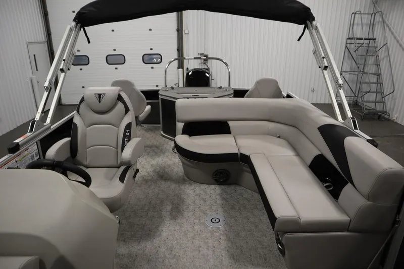 Slide: The Image of 2025 Trifecta 22TRFC LE 2.75 pontoon boat interior with plush seating and helm. - 35