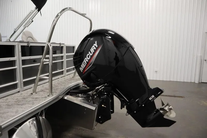 Slide: The Image of 2025 Trifecta 22TRFC LE 2.75 pontoon boat with Mercury outboard motor in a showroom. - 44