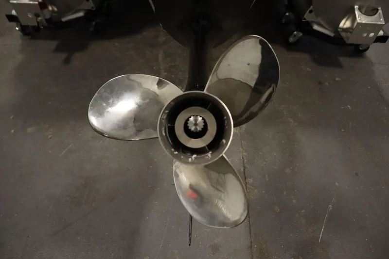 Slide: The Image of Close-up of a shiny propeller from a 2025 Trifecta 22TRFC LE 2.75 boat. - 48