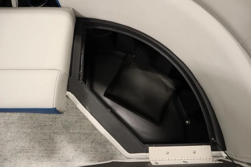 Slide: The Image of 2025 Trifecta 22RF LE 2.75 boat interior with beige and blue seating. - 12