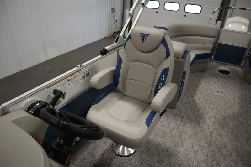 Slide: The Image of 2025 Trifecta 22RF LE 2.75 boat interior with steering console and captain's chair. - 17