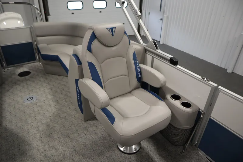 Slide: The Image of Interior storage compartment of 2025 Trifecta 22RF LE 2.75 boat, featuring cushioned seating. - 18