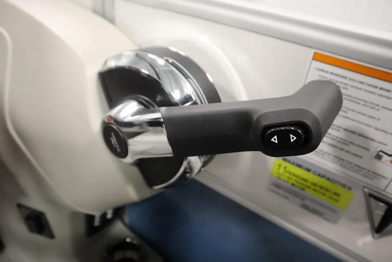 Slide: The Image of Close-up of 2025 Trifecta 22RF LE 2.75 boat throttle control handle. - 27