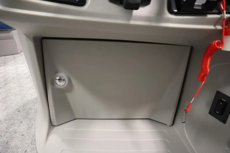 Slide: The Image of 2025 Trifecta 22RF LE 2.75 boat console with storage compartment and safety lanyard. - 31