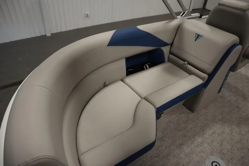 Slide: The Image of 2025 Trifecta 22RF LE 2.75 boat interior with beige and blue seating. - 35